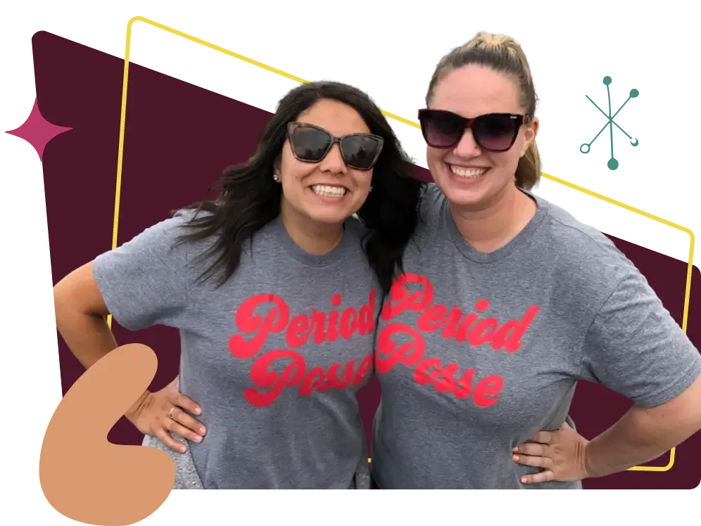 Two women sport 'Period Posse' t shirts at a packing party event